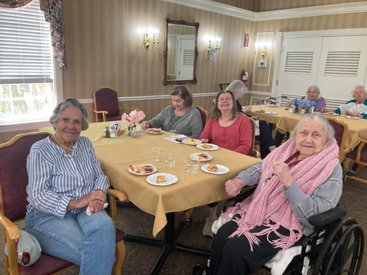 Residents enjoying a meal in a dining room