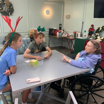 Residents and kids engaging in conversation during an activity