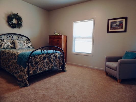 Cozy resident room with bed and seating area
