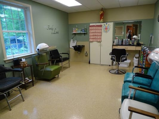 Hair salon area with styling chairs and equipment