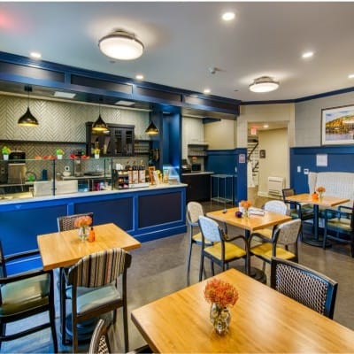 Bright dining area with tables and chairs