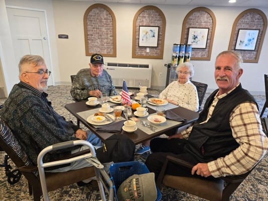 Residents enjoying breakfast in a dining area