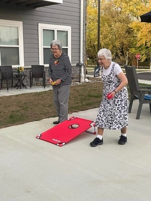 Two residents playing an outdoor game