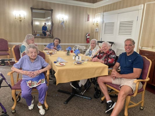 Residents enjoying snacks and conversation in a common area
