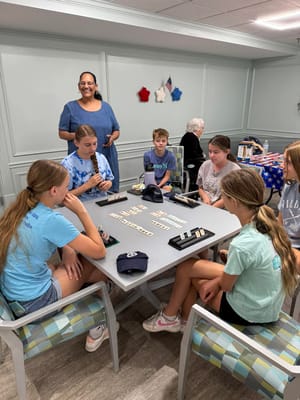 Children and residents playing games in a common area