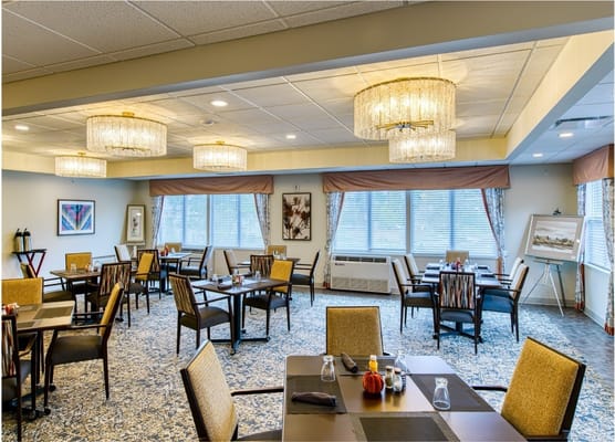 Elegant dining room setup with tables and chairs