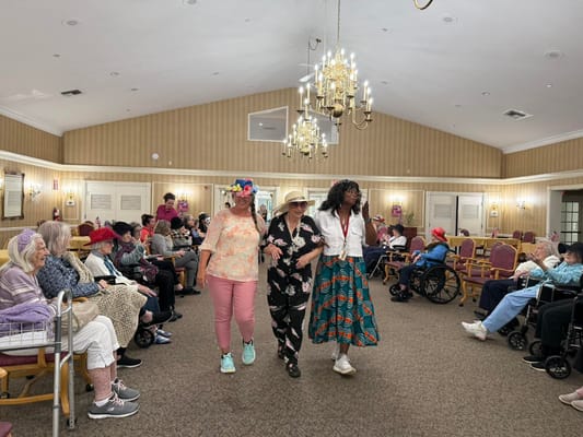 Residents and staff participating in an activity in a common area