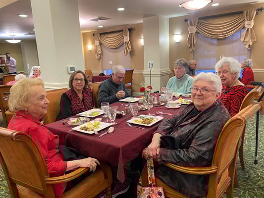 Residents enjoying a meal in the dining room