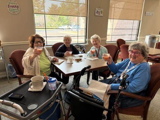 Residents enjoying drinks and socializing in a common area