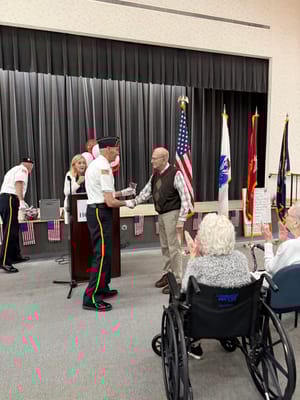 Residents and staff participating in a celebratory event