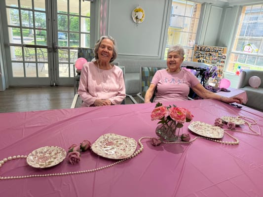 Two residents enjoying a social gathering in a common area