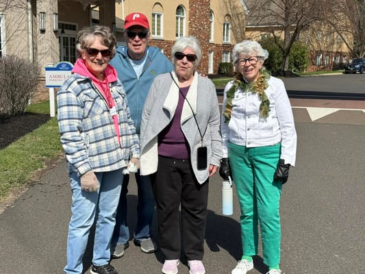 Residents enjoying a walk outside in spring weather