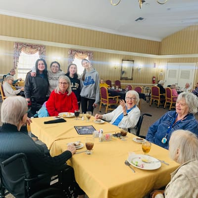 Residents enjoying a meal together in a common area