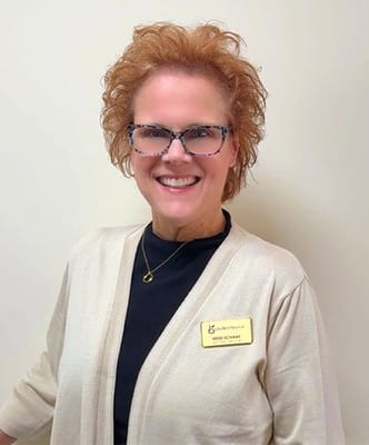 Staff member posing for a photo in the facility