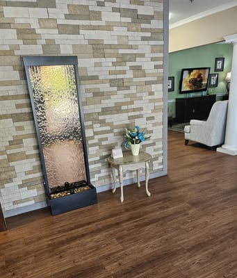 Elegant lobby with a water feature and décor