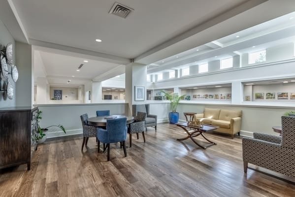 Bright common area with seating and artwork