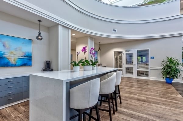 Bright interior of a common area with seating and plants