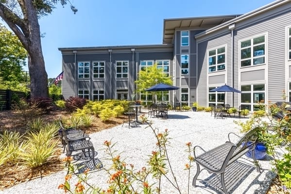 Outdoor courtyard with seating and greenery at Indigo Hall