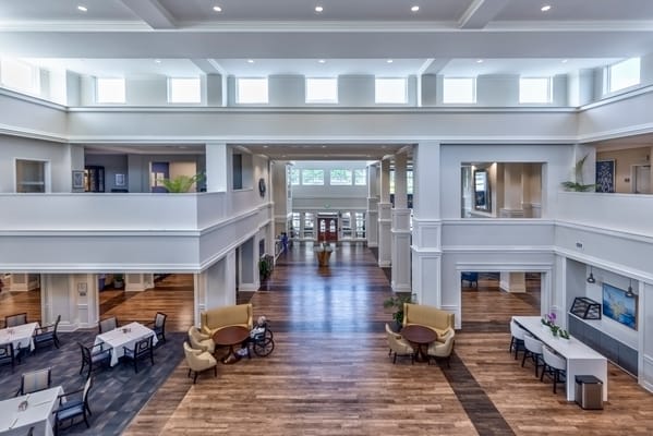 Bright common area with seating and wood flooring