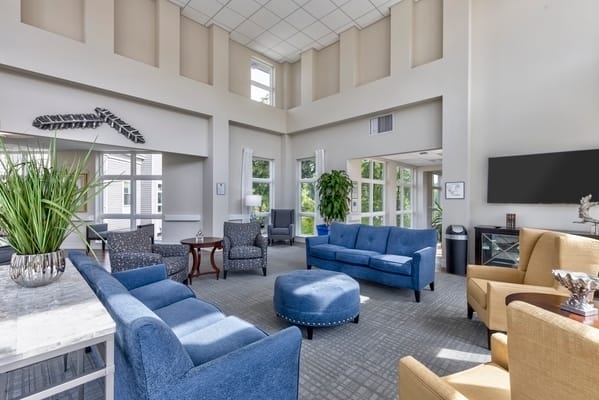 Bright common area with comfortable seating and natural light