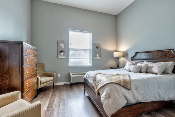 Cozy resident room with a bed and furniture