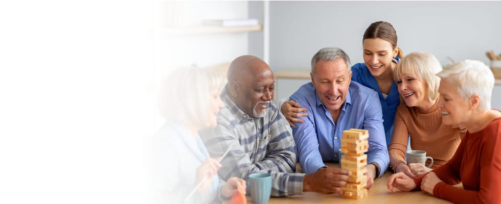 Residents enjoying a game of Jenga in a common area