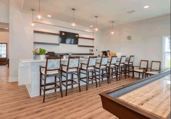 Bright common area with bar seating and decor