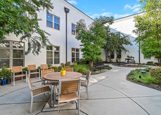 Outdoor courtyard with seating and greenery