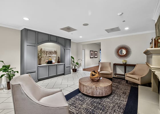 Bright common area with chairs and a round table