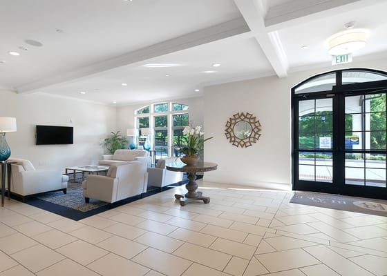 Bright lobby area with seating and natural light