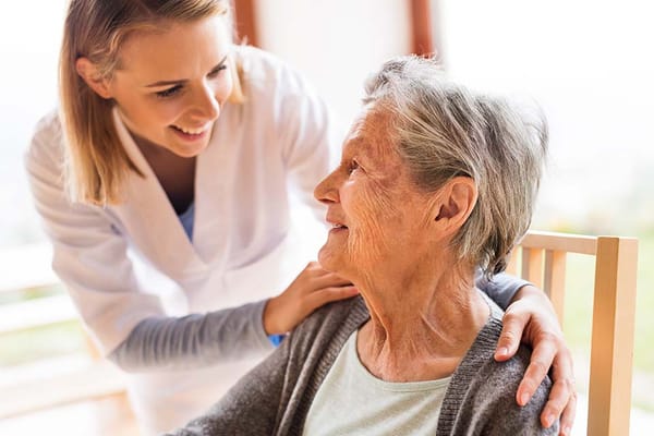 Caregiver interacting with a senior resident