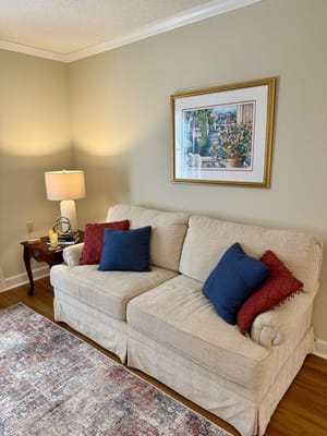 Cozy living room with a couch and lamp
