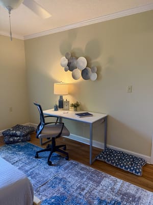 Cozy resident room with desk and decor
