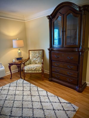 Cozy interior corner with a chair and cabinet