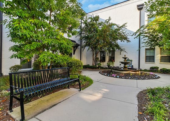 Outdoor space with fountain and seating area