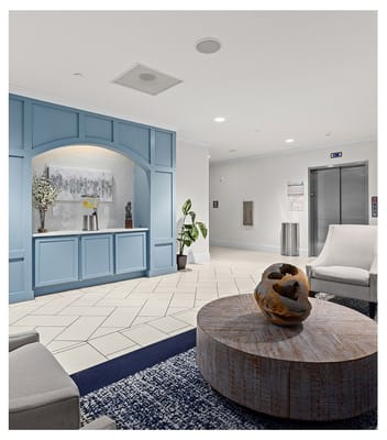 A modern interior space with seating and art decor