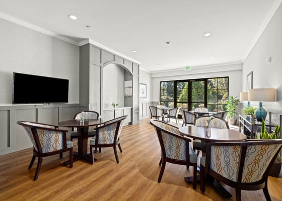 Bright common area with tables and chairs