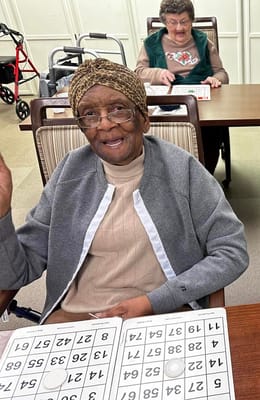 Residents enjoying a game of bingo in an activity room