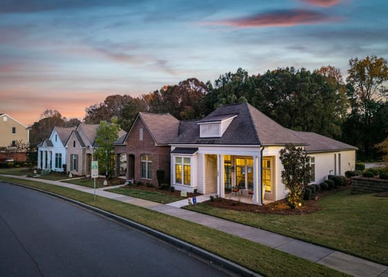 Exterior view of a residential facility at sunset