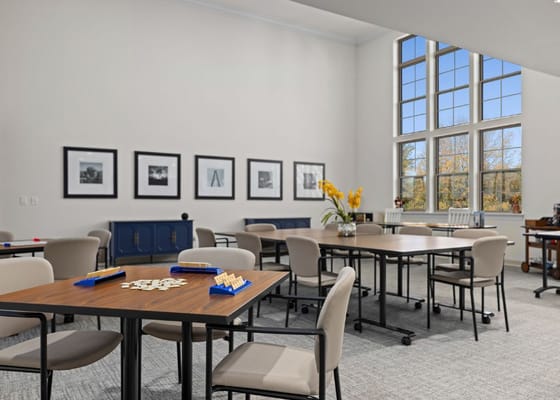 Bright activity room with tables and chairs