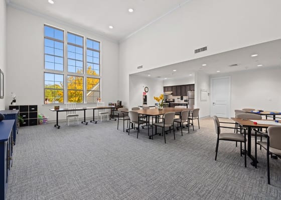 Bright activity room with tables and chairs