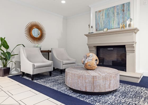 Comfortable lounge area with modern decor and fireplace