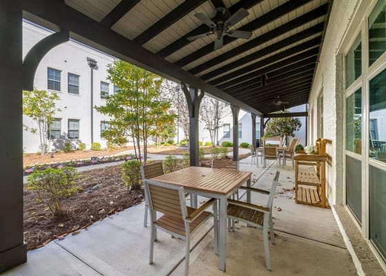 Patio area with seating and greenery