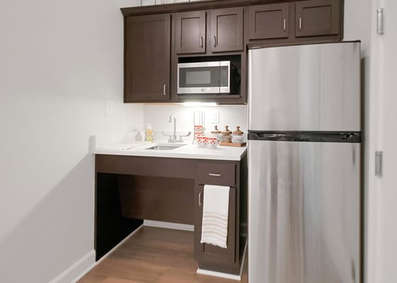 Bright kitchen area in a senior living apartment