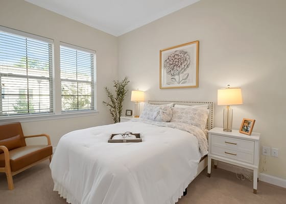 Brightly decorated resident bedroom with floral art