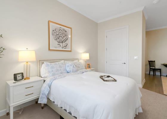 Cozy private resident room with a bed and lamps