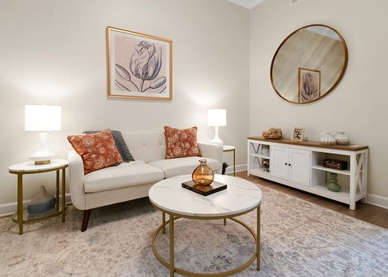 Bright living room setting with a couch and decorative items