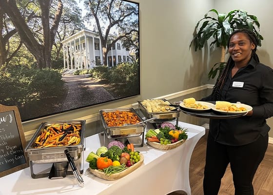 Staff serving a variety of meals in a dining area