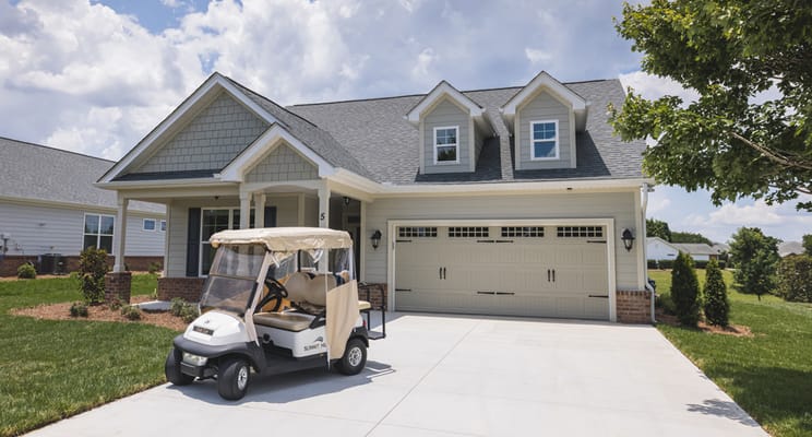 Exterior view of a facility with a golf cart