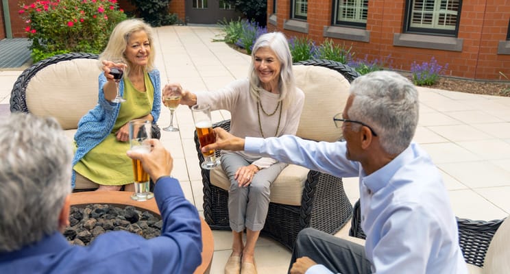 Residents enjoying drinks together in an outdoor area
